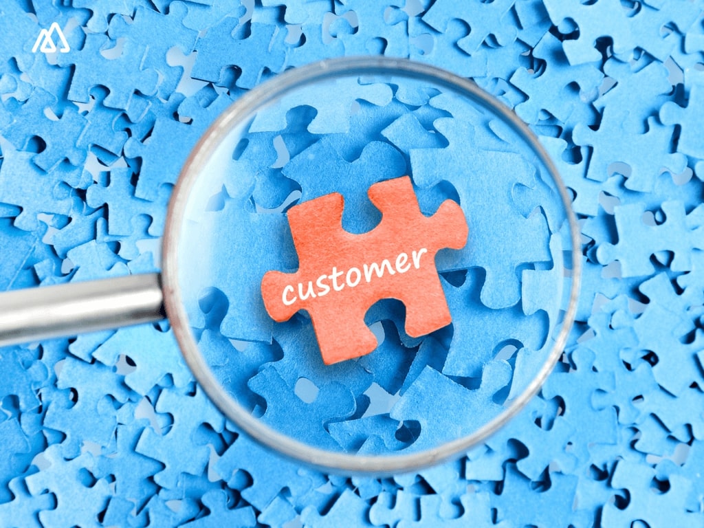 word customer on a puzzle piece and under a magnifying glass